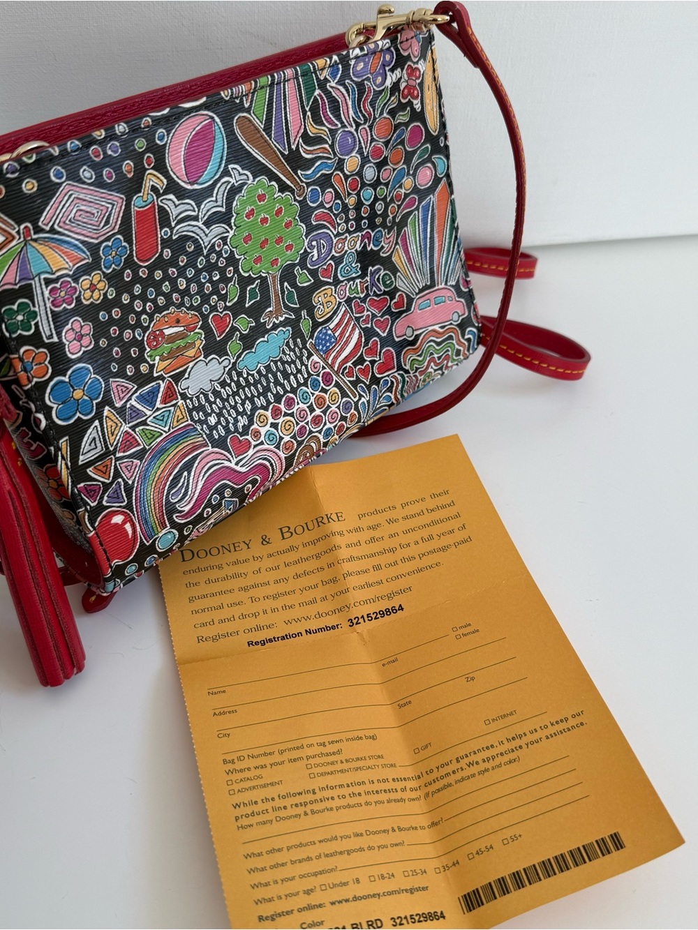 Dooney & Bourke Red Trim Multicolor Doodle-Print Wristlet